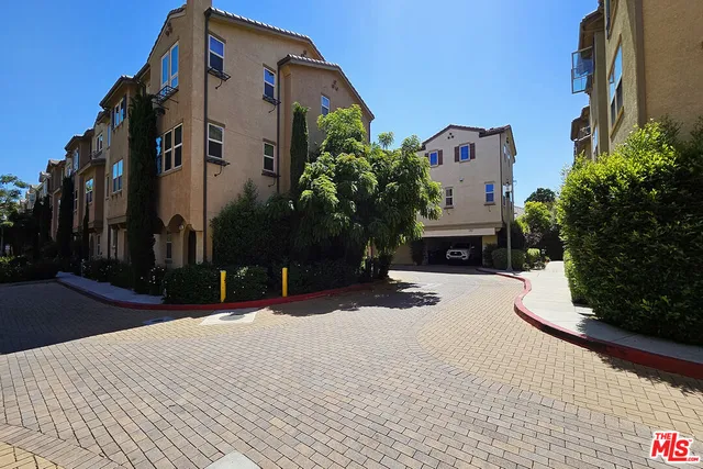 a street view with tall buildings