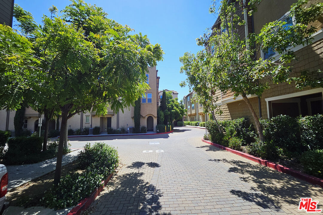 7245 Maple Road Van Nuys, CA 91405 - Photo 44 of 45 a front view of a house with garden