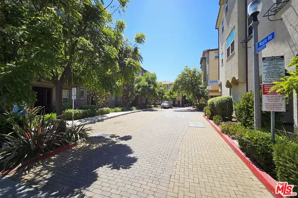a view of a garden with patio