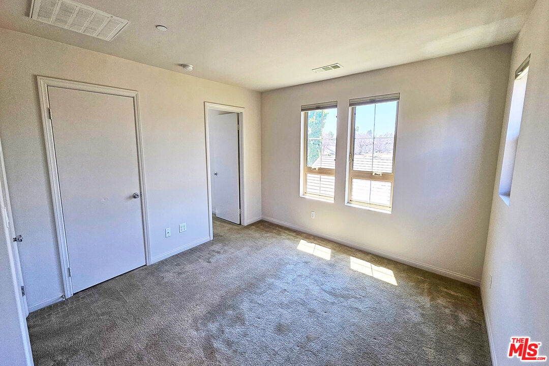 7245 Maple Road Van Nuys, CA 91405 - Photo 5 of 45 a view of an empty room with window and closet area