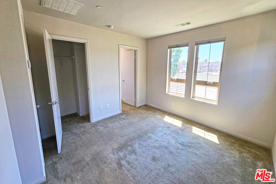 7245 Maple Road Van Nuys, CA 91405 - Photo 8 of 45 a view of a big room with windows and closet