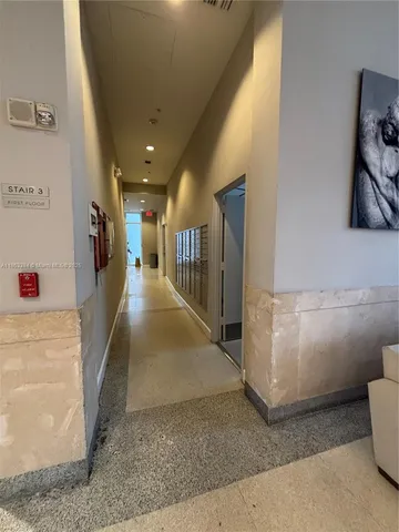 a view of a hallway view with staircase