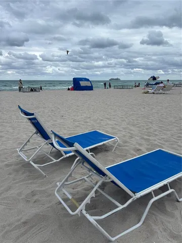 a view of roof deck with two chairs