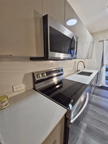 a kitchen with a stove and a microwave
