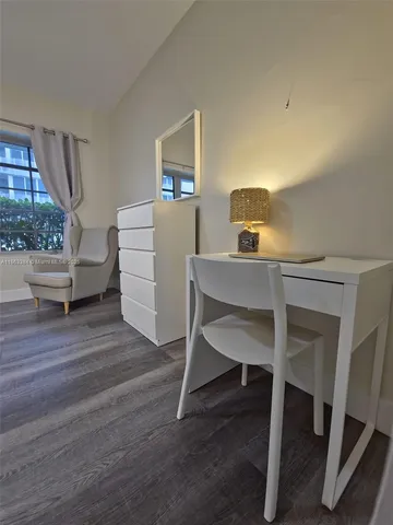 a workspace with furniture and window