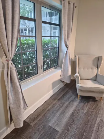 a bedroom with a bed and a lamp