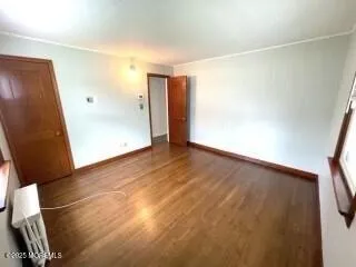 a bathroom with a granite countertop sink a toilet a mirror and shower