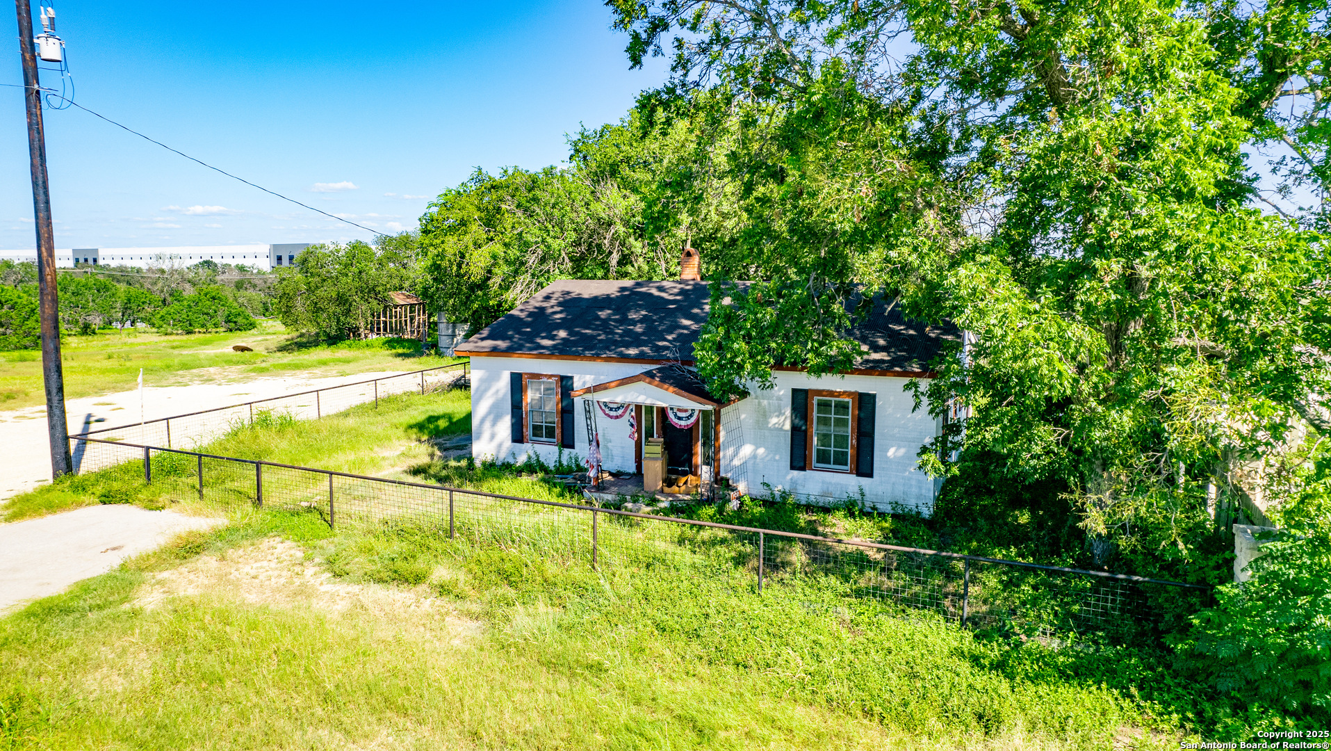 16874 Lookout Road Selma, TX 78154 - Photo 4 of 8 a view of a house with pool and a yard