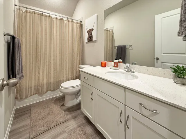 a bedroom with a bed and a table in it