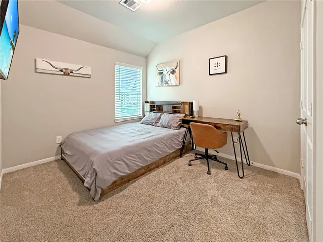 a view of a house with backyard and porch