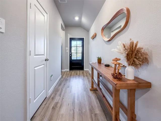 a hallway with wooden floor