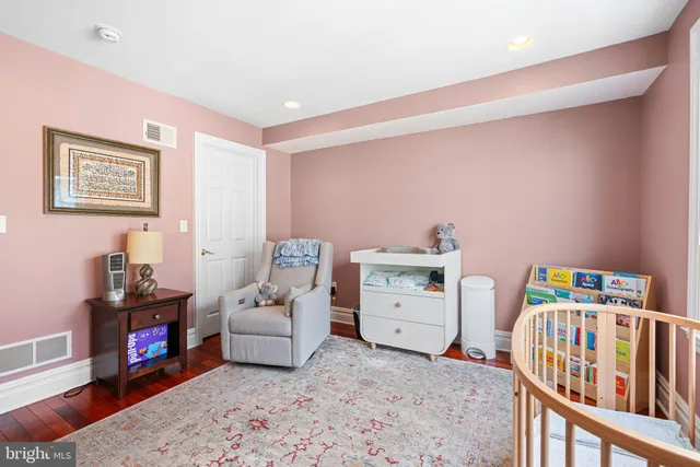 a bed room with a bed and a baby bed