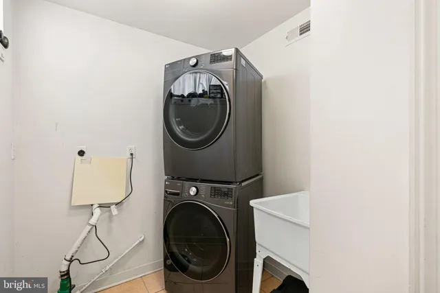 a utility room with dryer and washer