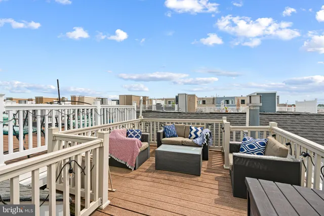 a view of roof deck with seating space and barbeque oven