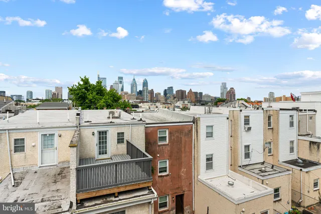a view of city with tall buildings