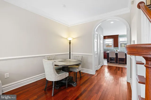 a view of a room with furniture and wooden floor