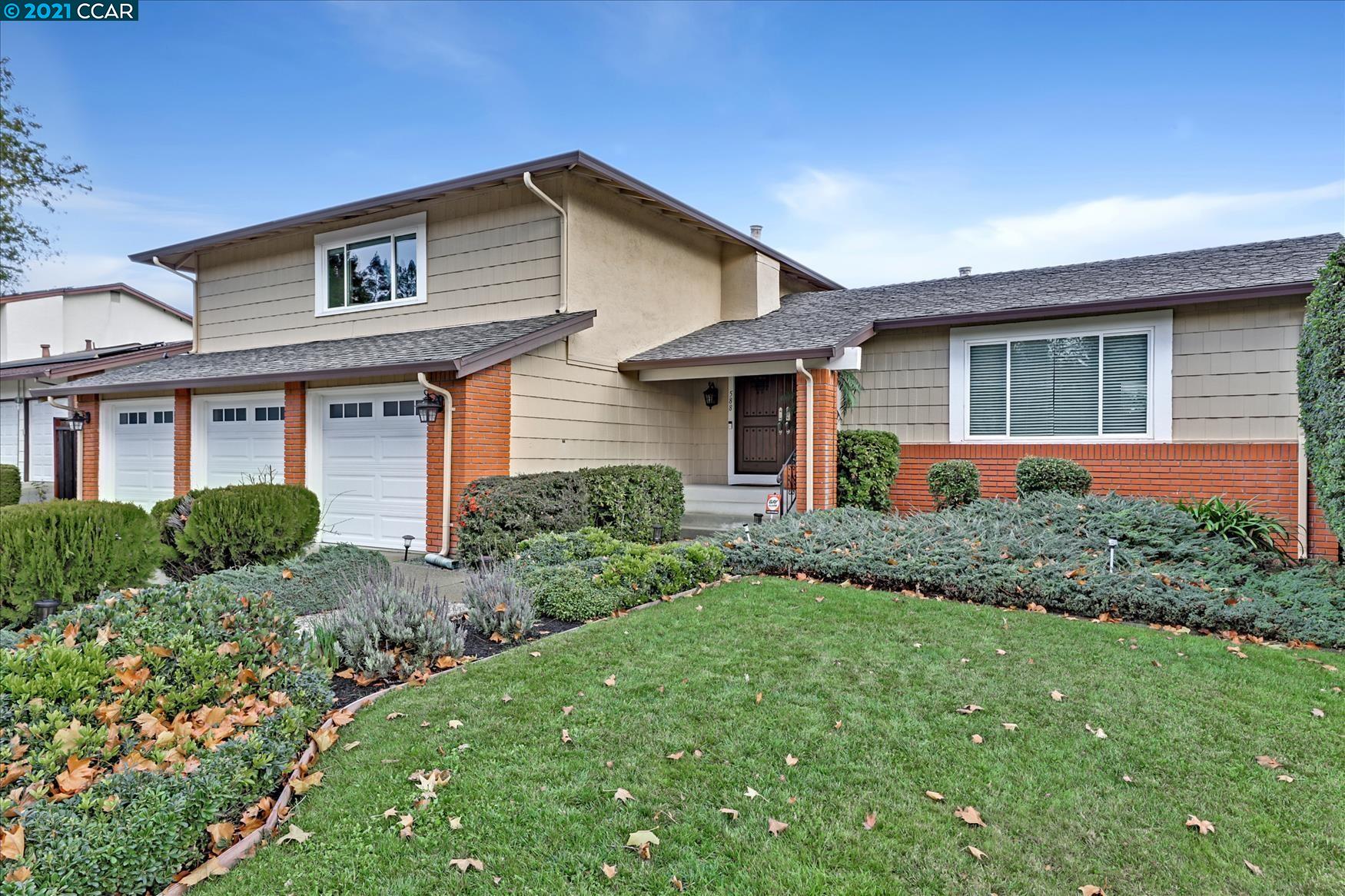 588 Santander Drive San Ramon, CA 94583 - Photo 1 of 1 a front view of a house with a garden