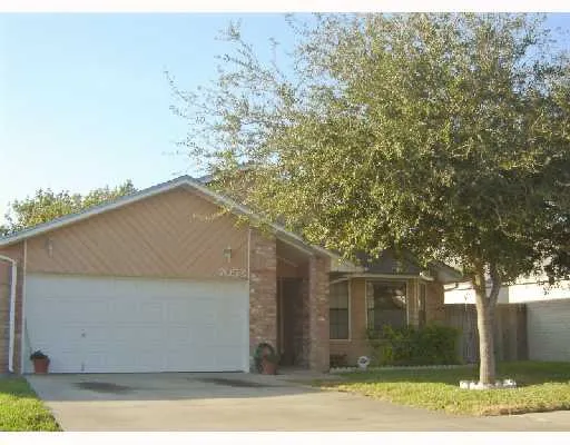 front view of a house with a trees