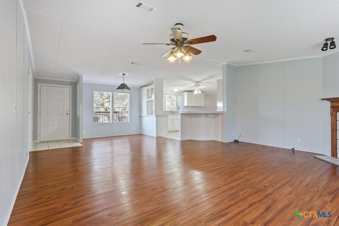 706 County Road 3376 Kempner, TX 76539 - Photo 11 of 31 a view of an empty room with window and wooden floor
