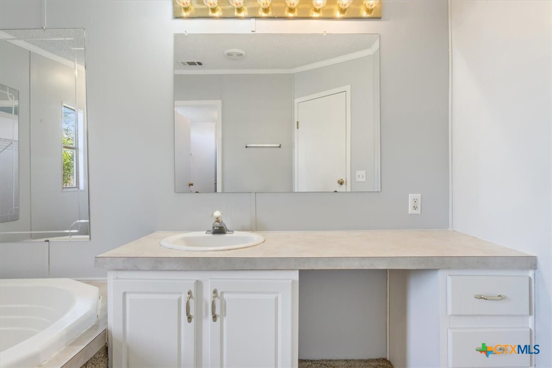 706 County Road 3376 Kempner, TX 76539 - Photo 21 of 31 a bathroom with a sink and a mirror