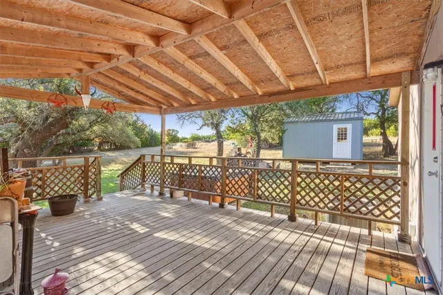 a view of a park with large trees