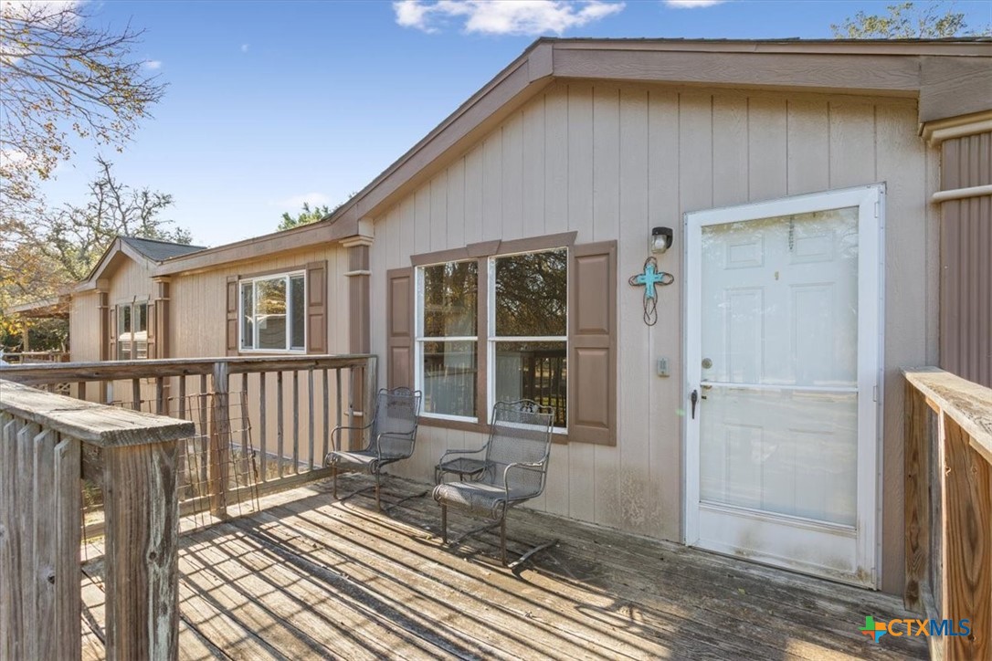 706 County Road 3376 Kempner, TX 76539 - Photo 6 of 31 a front view of a house with a glass door