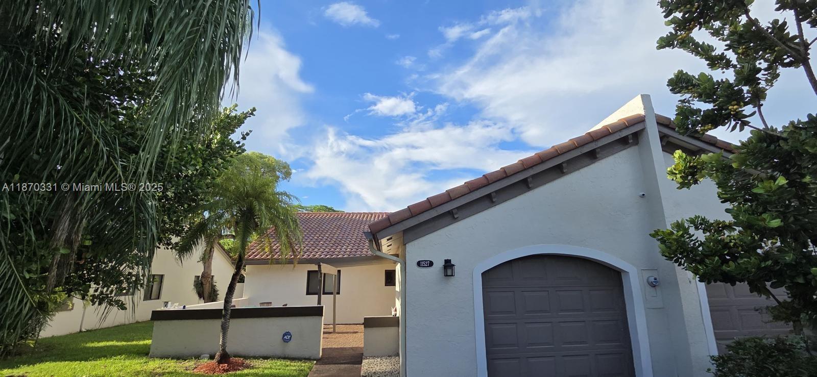 11527 Southwest 84th Lane Miami, FL 33173 - Photo 7 of 17 a front view of a house with garden