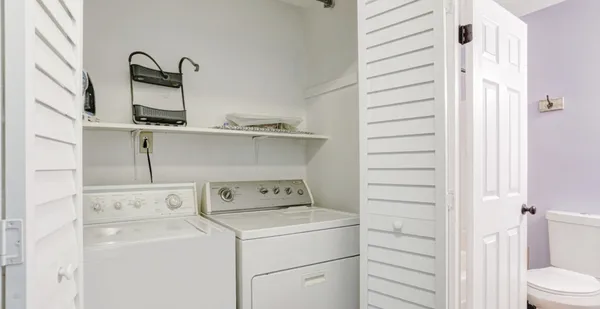 a utility room with dryer and washer