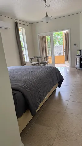 a bedroom with a bed and a mirror