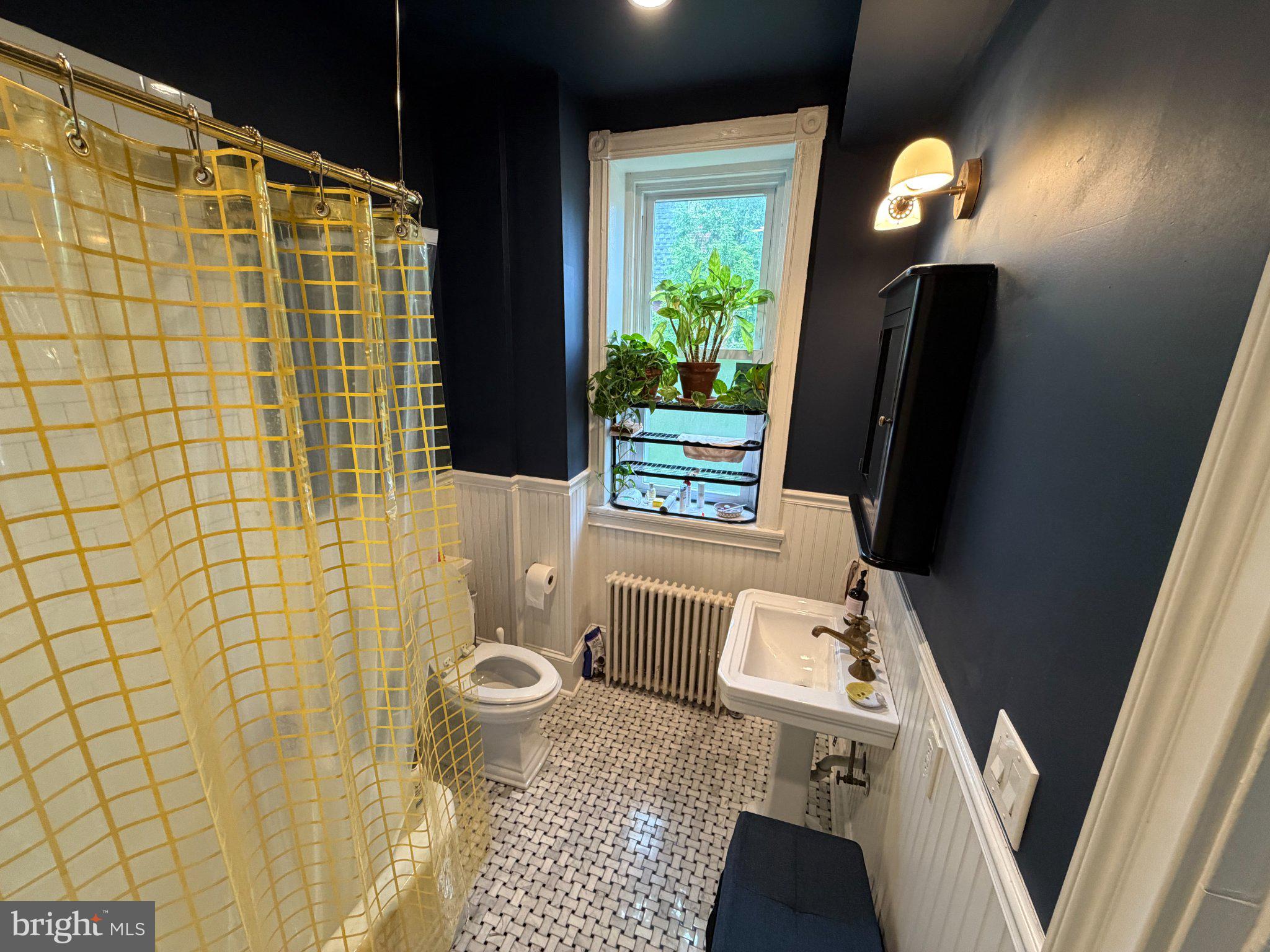 815 South 49th Street Philadelphia, PA 19143 - Photo 30 of 72 a bathroom with a sink toilet and shower