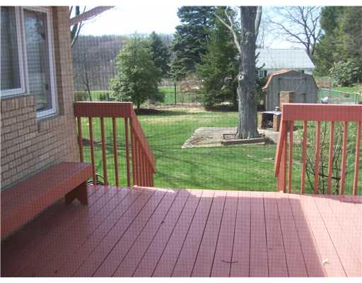219 Country Club Road Butler, PA 16002 - Photo 16 of 18 Exterior Front. Spacious deck and richly landscaped yard