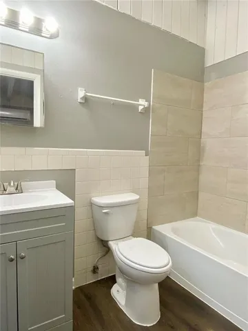 a bathroom with a toilet a sink and bathtub