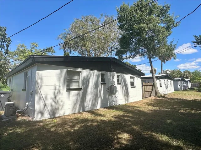 a view of a house with a tree