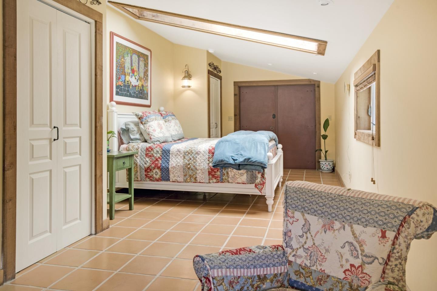 241 Bronco Road Soquel, CA 95073 - Photo 62 of 86 a bedroom with a bed and a mirror