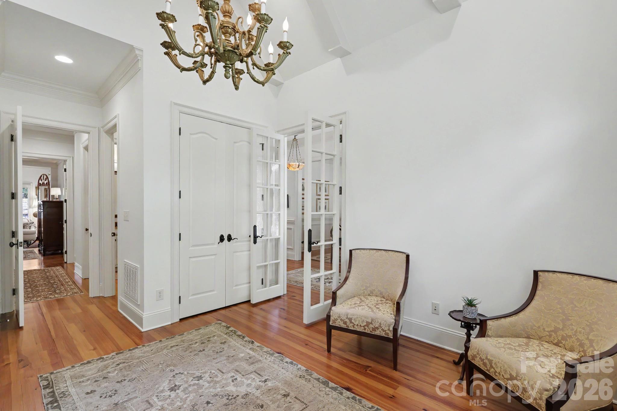 508 Hideaway Ridge Court Matthews, NC 28105 - Photo 7 of 47 a view of a hallway with furniture and wooden floor