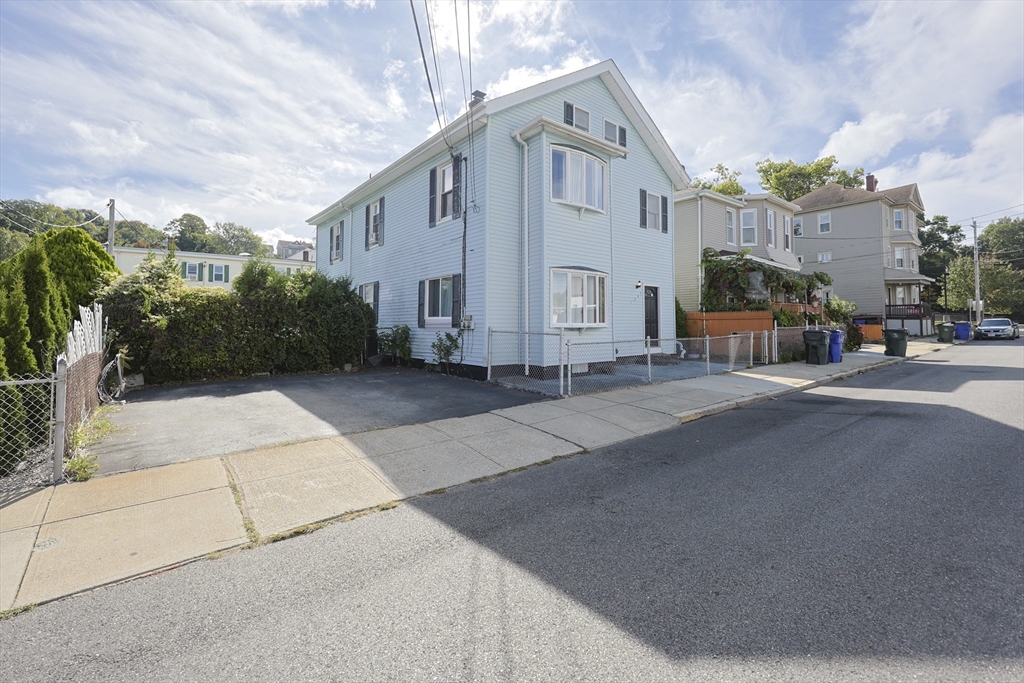 a view of a street with houses