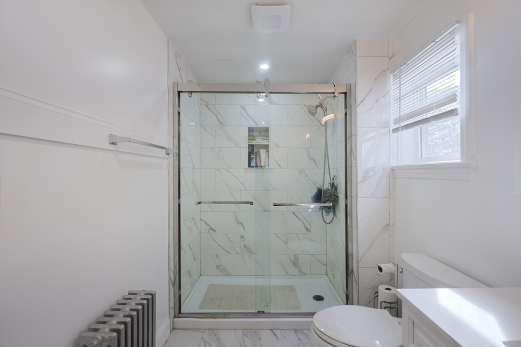 1245 North High Street Fall River, MA 02720 - Photo 17 of 28 a bathroom with a shower a toilet and a sink