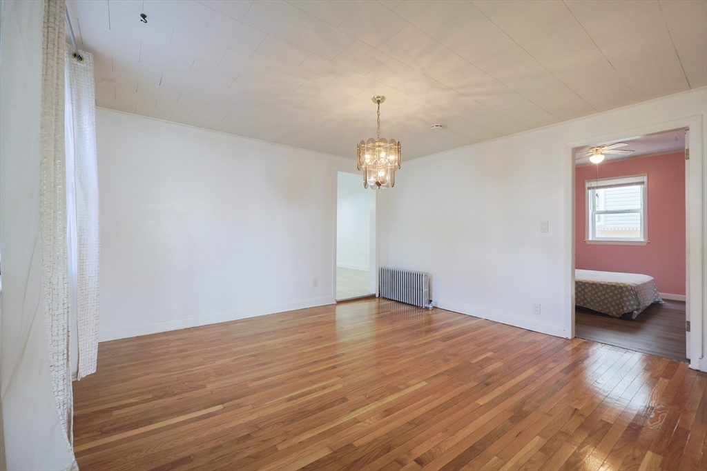 1245 North High Street Fall River, MA 02720 - Photo 19 of 28 a view of an empty room with wooden floor and a window