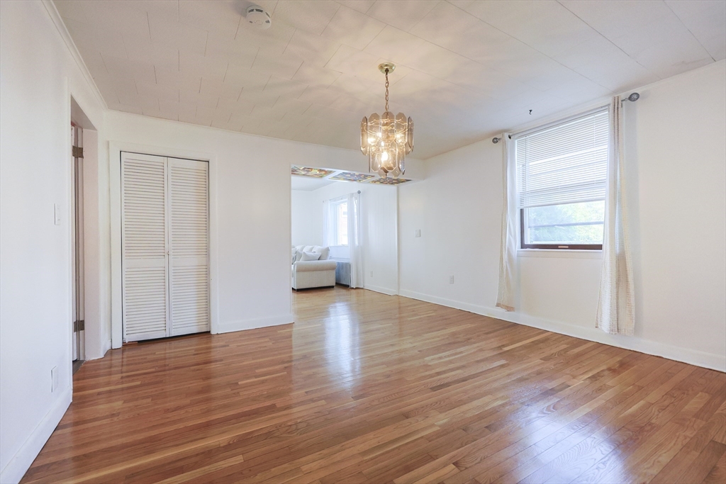 1245 North High Street Fall River, MA 02720 - Photo 20 of 28 a view of an empty room with wooden floor and a window