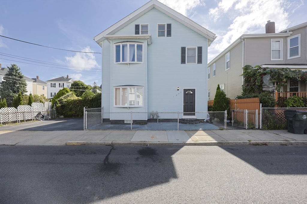 1245 North High Street Fall River, MA 02720 - Photo 2 of 28 a front view of a house with garden