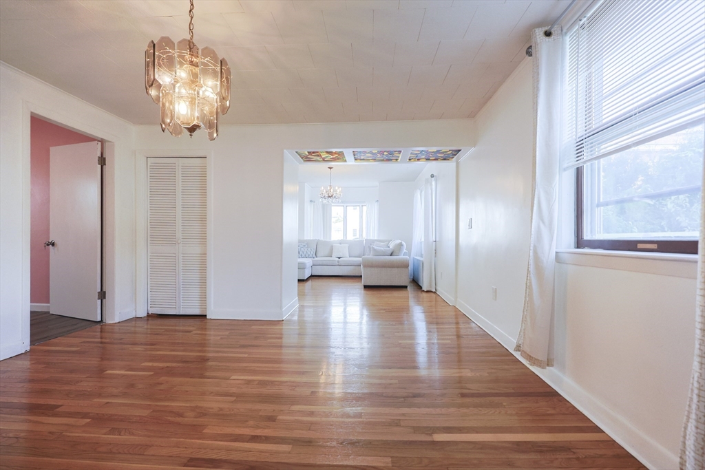 1245 North High Street Fall River, MA 02720 - Photo 21 of 28 a view of livingroom with hardwood floor and kitchen view
