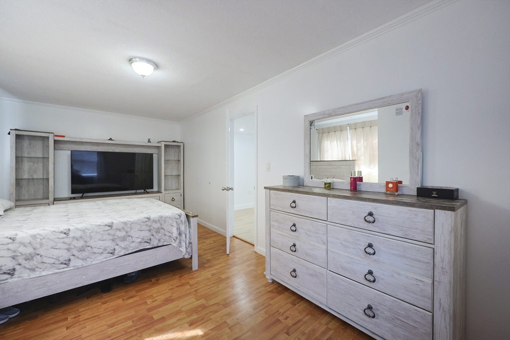 1245 North High Street Fall River, MA 02720 - Photo 23 of 28 a bedroom with a bed and a television