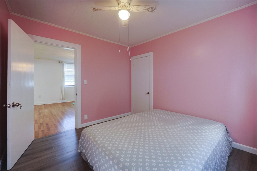 1245 North High Street Fall River, MA 02720 - Photo 26 of 28 a big room with wooden floor and chandelier fan