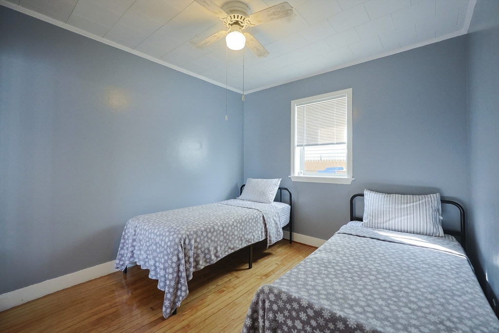 1245 North High Street Fall River, MA 02720 - Photo 28 of 28 a bedroom with two beds and window