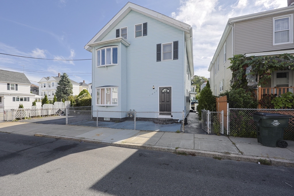 1245 North High Street Fall River, MA 02720 - Photo 3 of 28 a front view of a house with a yard