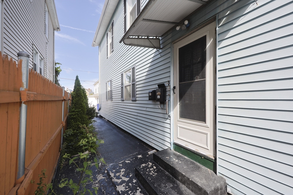1245 North High Street Fall River, MA 02720 - Photo 4 of 28 a view of a balcony with a potted plant