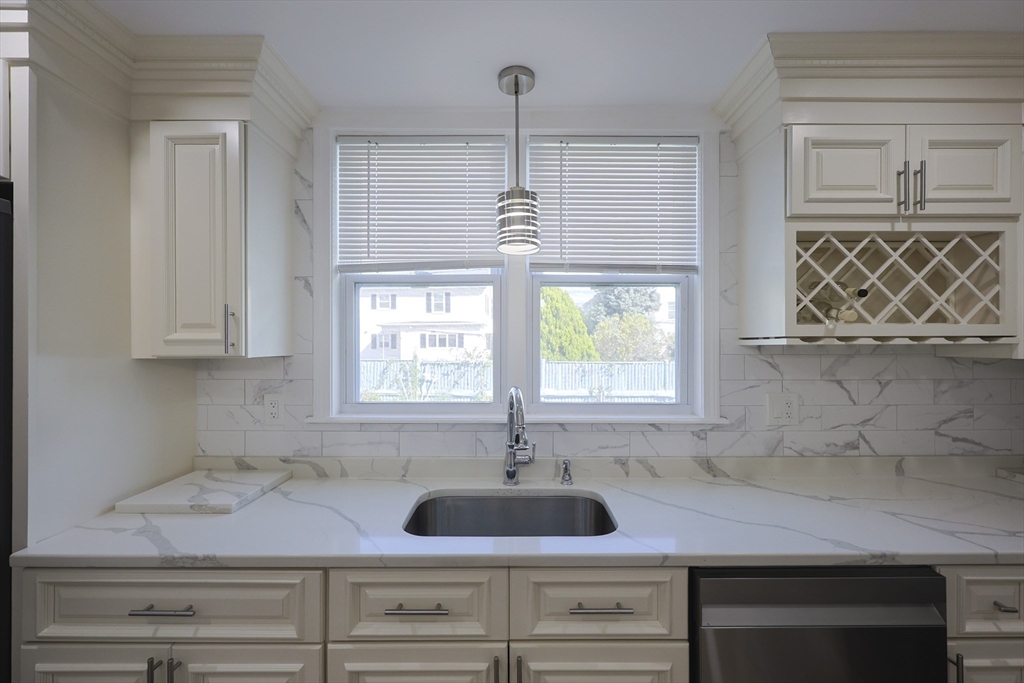 1245 North High Street Fall River, MA 02720 - Photo 9 of 28 a kitchen with a sink and a window
