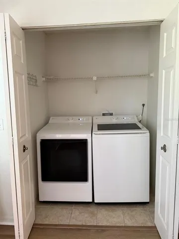 a utility room with washer and dryer
