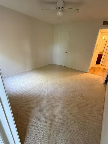 an empty room with a bathroom