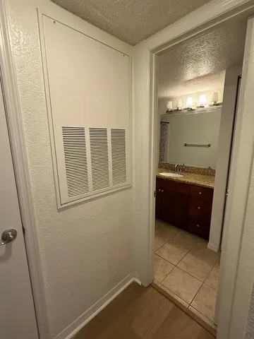 a bathroom with a tub and a sink